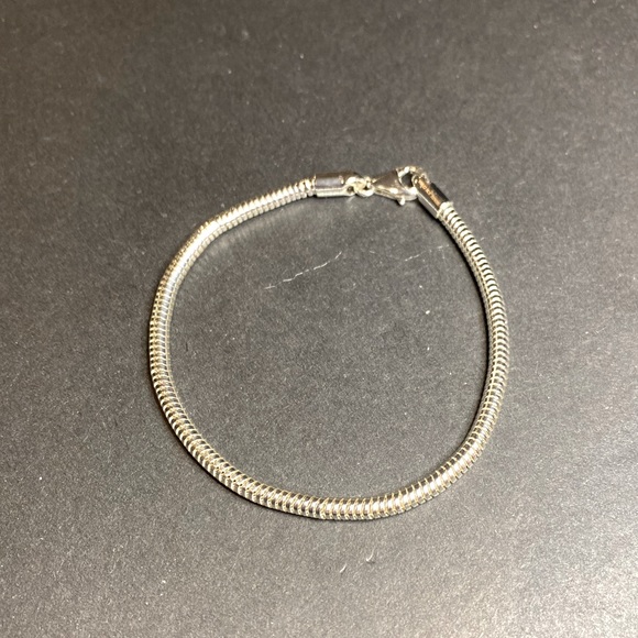 Silver toned charm bracelet. Note this bracelet is not Pandora - Picture 2 of 3